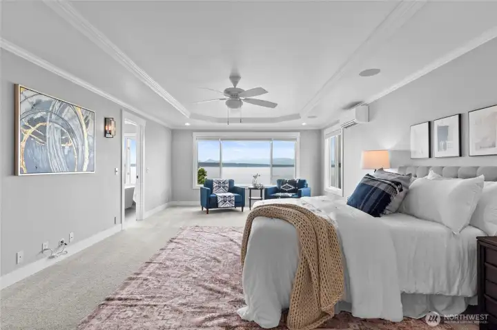 Spacious Primary with Ensuite anchored by wall - to -wall windows  of Sound views.
