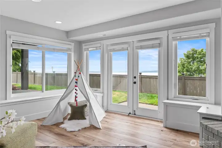 More water views from the bottom floor! PLUS, right outside French doors, home is wired and plumbed for easy hot-tub addition.