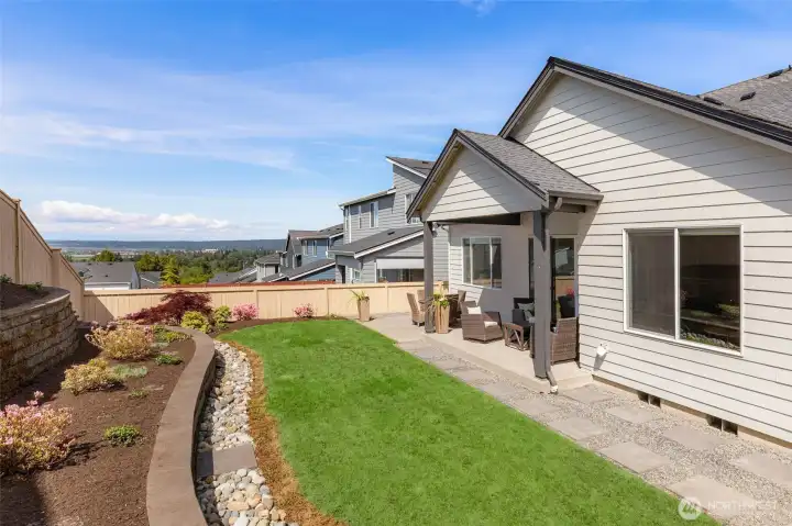 Layered terraces in the back yard provide room for the gardening enthusiast to explore their botanical talents!