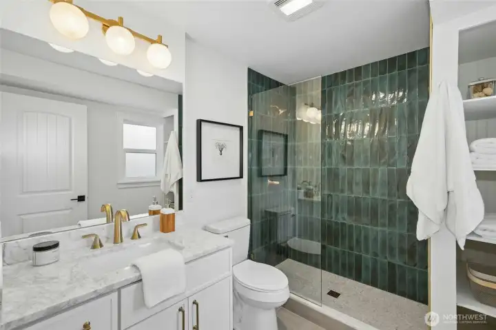 Remodeled Primary bathroom with built in linen closet. Remodeled Primary bathroom with built in linen closet.