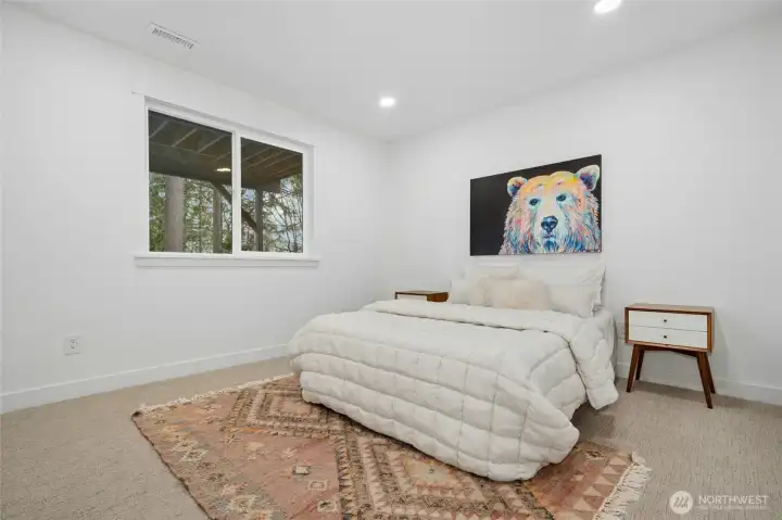 Downstairs bedroom or second primary suite with ensuite bathroom. Downstairs bedroom or second primary suite with ensuite bathroom.