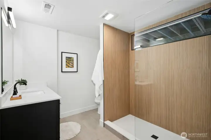 Downstairs bathroom off of the 2nd primary suite is spacious and completely remodled. Downstairs bathroom off of the 2nd primary suite is spacious and completely remodled.