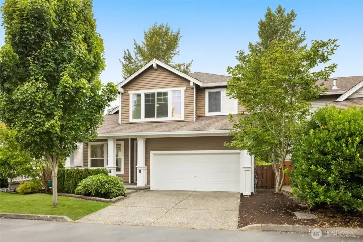 Craftsman curb appeal in Crosswater — mature landscaping and a two-car garage welcome you home. Craftsman curb appeal in Crosswater — mature landscaping and a two-car garage welcome you home.