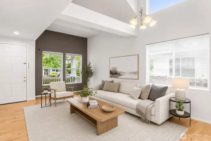 Bright living room with high ceilings and abundant natural light. Bright living room with high ceilings and abundant natural light.