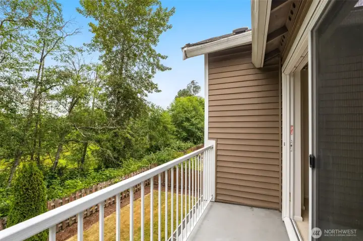 Private deck off the primary suite, overlooking the backyard and wetlands beyond. Private deck off the primary suite, overlooking the backyard and wetlands beyond.