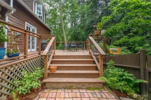 Generous steps connect the deck and front grounds.