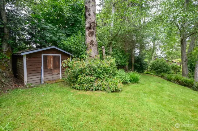 At the southern end of the property, a small outbuilding with private, separate access from the street.