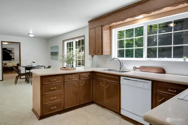 Sliding pocket door leads to large kitchen with plenty of counter space