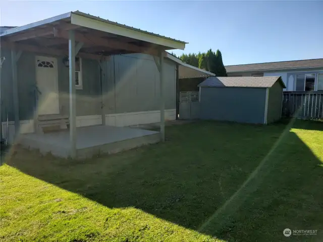 Another View of the Newer Huge Entertainment Sized Deck looking into the Pet Friendly Fully Fenced Backyard Showing Large Storage Shed.