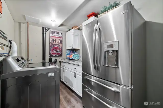 Laundry room in lower level. Washer & dryer purchased just this year! Fridge stays with home.