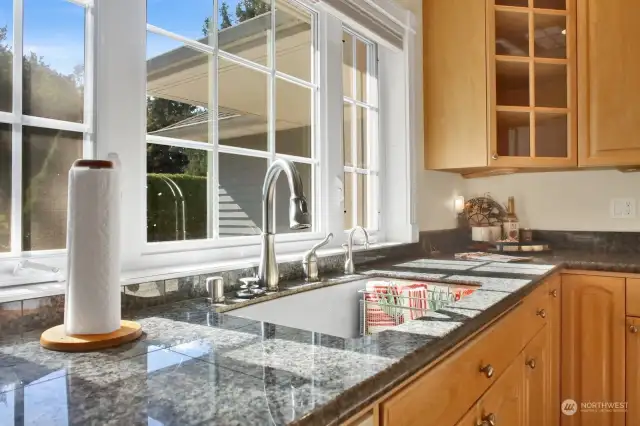 Cleaning up is a breeze with this beautiful view! Take in the views of the patio space through the kitchen window.