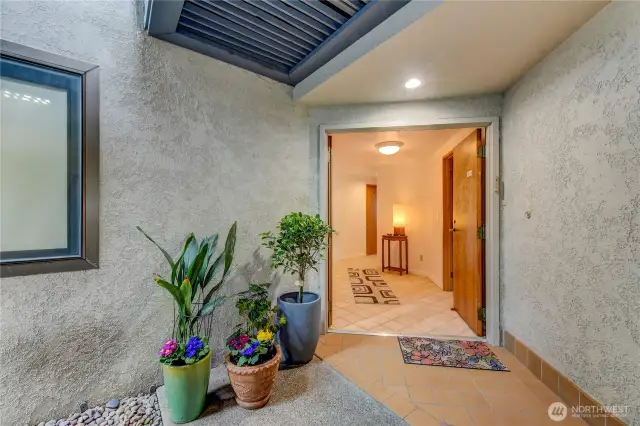 As you approach this corner location, the double entry invites you into a generous & bright foyer.