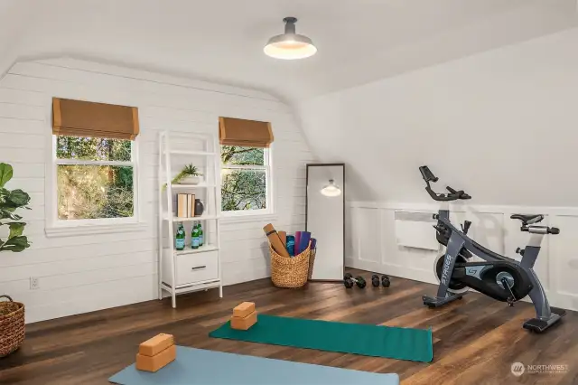 The property also includes a detached two-car garage with a carriage house, offering a luxe guest suite, workout room or office with a full bath