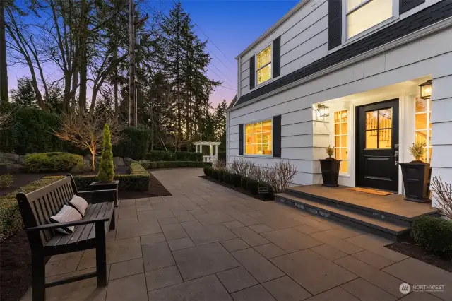 Charming entry with elegant curb appeal and a beautifully landscaped patio.