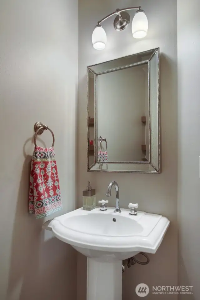 Powder room adjacent to the den.