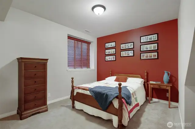 Downstairs bedroom is next to a full bathroom.