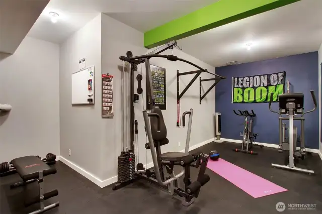 Home gym space includes the television on the wall (not shown).