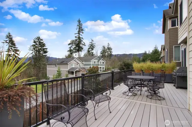 Expansive deck is plumbed with a BBQ gas hookup and has  views of Tiger Mountain.