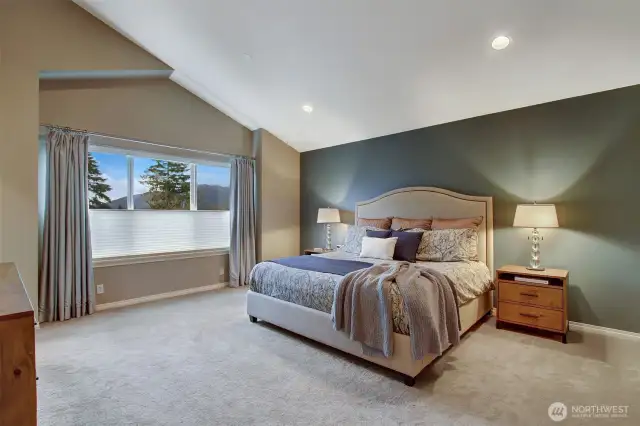 Lofted ceiling in primary bedroom.