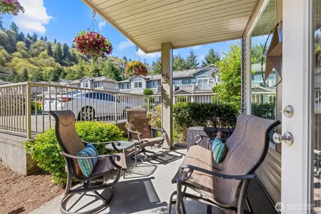 Start your mornings with coffee and fresh air or unwind after a long day on this private covered patio surrounded by greenery and mountain views.