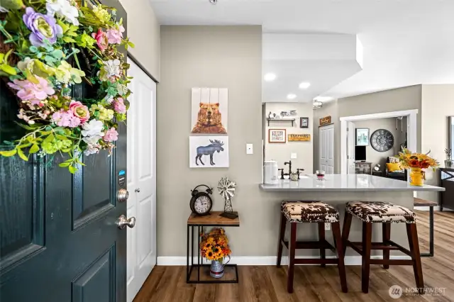 Step inside to rich laminate hardwood floors, a spacious open layout, and a flood of natural light—setting the tone for stylish, low-maintenance living from the moment you walk in.