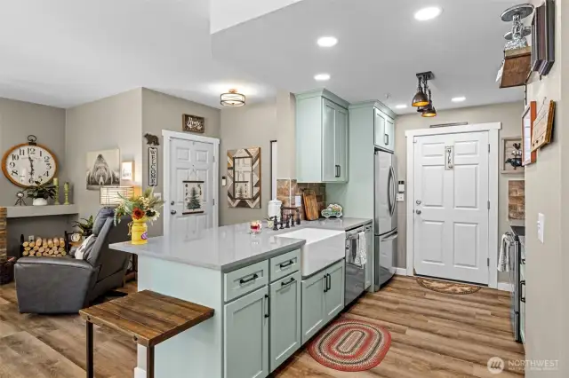 The heart of the home—this stylish kitchen overlooks the dining and living area, perfect for everyday life or entertaining.