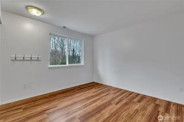 The upper level bedroom is large and has wood floors.