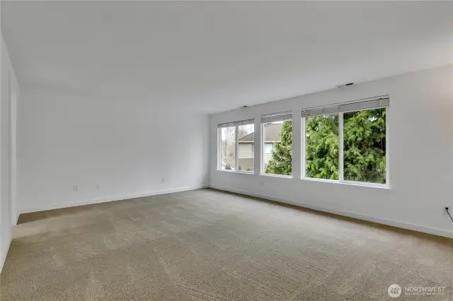 The primary bedroom suite is extremely spacious with lots of natural light.