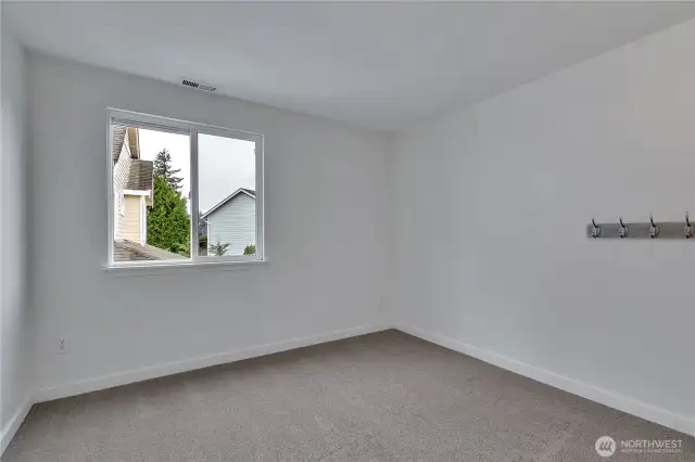 Here is another large bedroom with a big window.