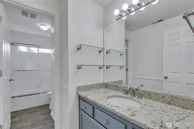 This large, full bathroom is well appointed and serves the upper level bedrooms.