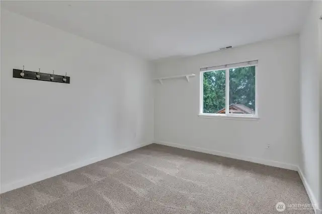 This large bedroom also overlooks the backyard.