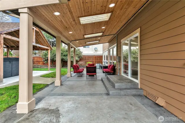 The custom, covered patio space is perfect for entertaining or relaxing any time of year!