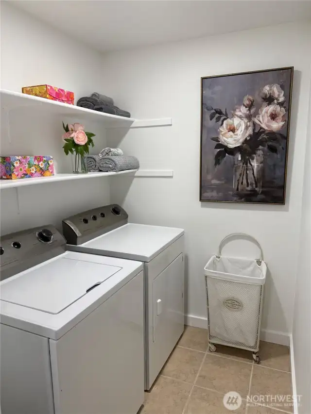 Spacious Laundry Room w/ ample shelving storage
