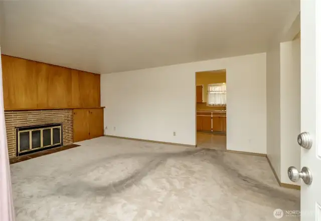 Spacious living room with wood-burning fireplace