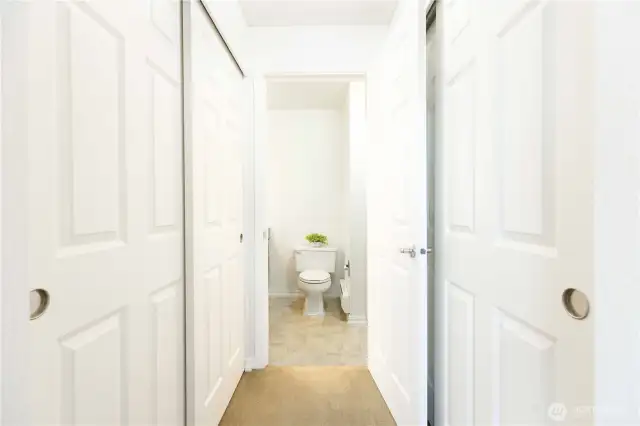 2 closets in the hallway to the primary bathroom