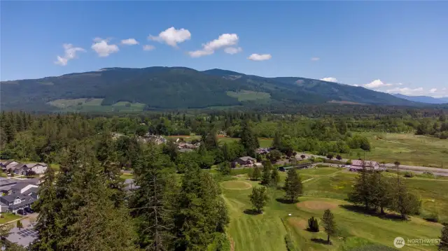 View of golf course and mountains from deck