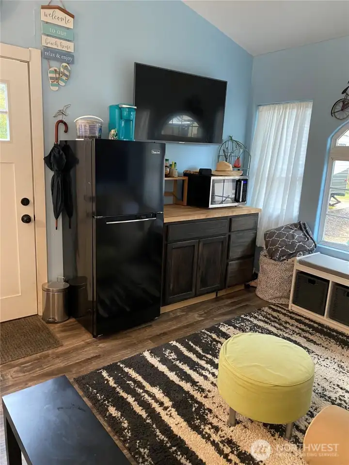 Cabinets and TV. Owners did have a refrigerator which you could easily add.