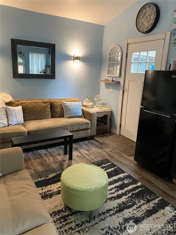 Decorative lighting on the north wall. Lots of room for hideaway bed, sofa, chairs.