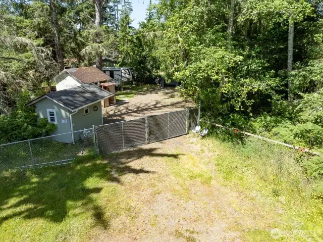 Nestled among the trees is this private beach retreat with 6' privacy fencing completely surrounding the property.
