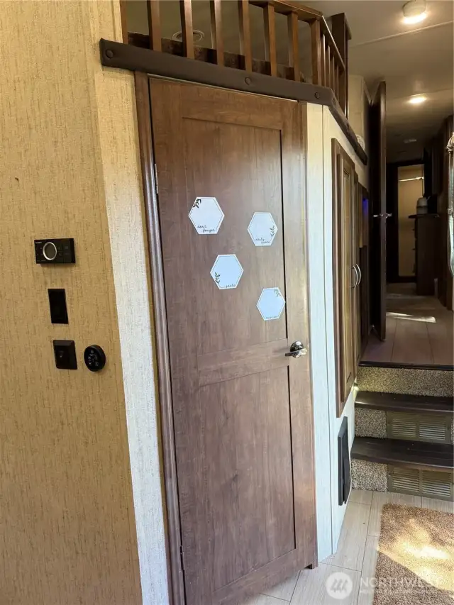 This 5th Wheel has two bedrooms and a sleeping nook.