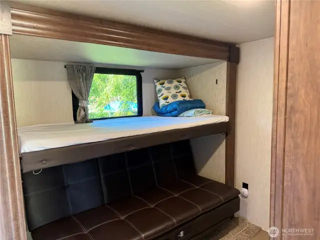 Guest bedroom with bunk beds and can be a lounge area. The bottom opens for more sleeping comfort.