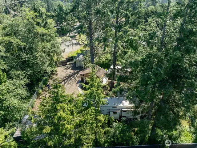 Aerial view shows the fencing and privacy of this property.