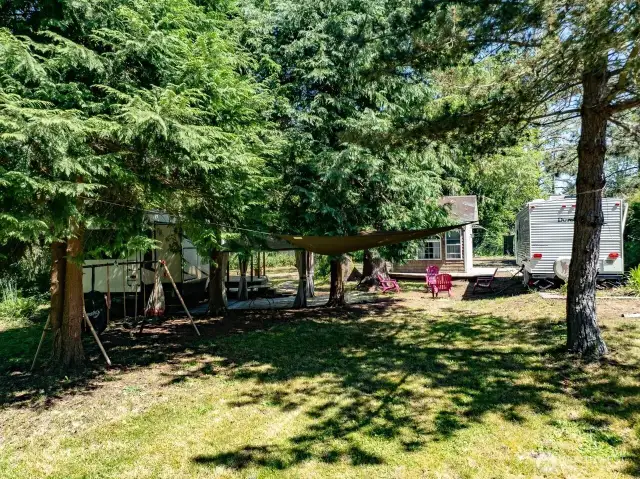 There are two trailers, bunkhouse and laundry shed and swing set to round out this retreat.