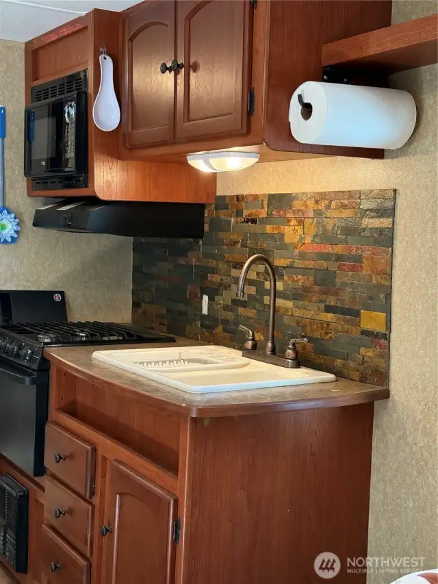 Nice kitchen with stove/oven and microwave. Dinette table not shown.