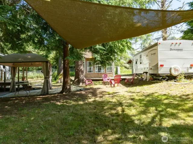 Closer look, property has a gazebo and large lawn area.