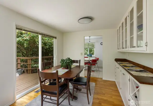 Dining Area with Builtin Cabinets + Slider to Side Patio