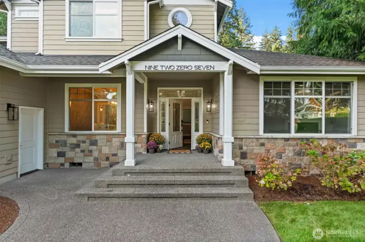 The large front porch invites you in with cozy fall vibes.