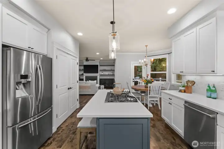 Sleek quartz counters and premium appliances throughout