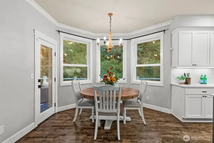 Bright nook surrounded by nature and backyard charm.