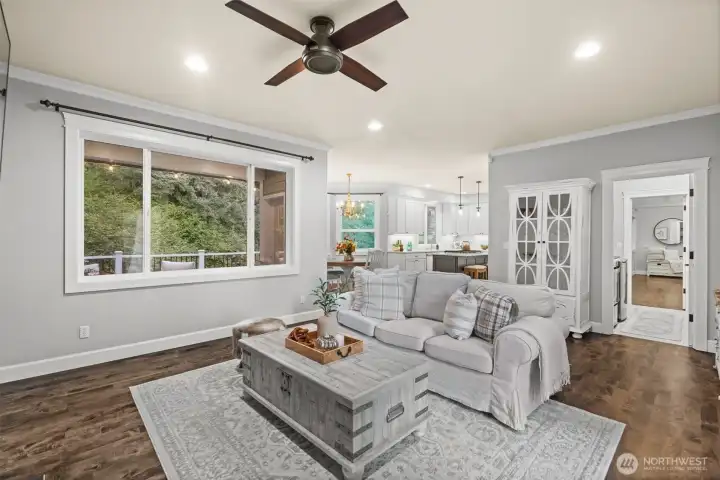 Hardwood flooring and light, airy finishes fill the home.